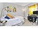 Bright bedroom with unique wall art, desk, and a cozy bed with decorative pillows at 1416 S Church St, Charlotte, NC 28203