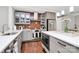 Well-equipped kitchen featuring stainless steel appliances, custom cabinets, and a striking brick backsplash at 1416 S Church St, Charlotte, NC 28203