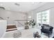 Bright and airy living area with tile flooring, a bar cart, and a sliding glass door to a patio at 1416 S Church St, Charlotte, NC 28203