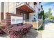 Eye-level side view of Lumina community sign in front of stylish townhomes and attractive flower bed at 1416 S Church St, Charlotte, NC 28203