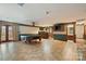 Recreational basement area featuring a pool table, bar, and bathroom, perfect for entertaining guests at 15670 Bethel Avenue Ext, Midland, NC 28107