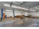 Spacious garage area with open ceiling and lift, perfect for car enthusiasts at 15670 Bethel Avenue Ext, Midland, NC 28107