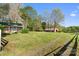 View of multiple outbuildings and storage units on the property, surrounded by green lawns at 15670 Bethel Avenue Ext, Midland, NC 28107