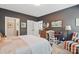 Well-appointed bedroom with a desk area, ample storage, and a cozy ambiance at 164 Riverstone Dr, Davidson, NC 28036
