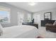 Bright bedroom boasts an ensuite bathroom, desk, and a comfortable sleeping area at 164 Riverstone Dr, Davidson, NC 28036