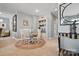Bright dining area with a round table, white chairs, and a charming bookcase at 164 Riverstone Dr, Davidson, NC 28036
