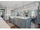 Stylish kitchen with a large island, stainless steel appliances, and an open view of the living space at 164 Riverstone Dr, Davidson, NC 28036
