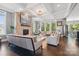 Spacious living room featuring a stone fireplace, coffered ceilings, and an open floor plan at 164 Riverstone Dr, Davidson, NC 28036