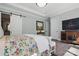 Well-lit main bedroom featuring neutral walls, a decorative rug on hardwood floors and a sliding barn door at 164 Riverstone Dr, Davidson, NC 28036