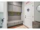Mudroom with gray built-in storage, bench seating, and a convenient entryway design at 164 Riverstone Dr, Davidson, NC 28036