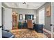 Well-appointed home office with coffered ceilings, custom built-ins, and a comfortable leather desk chair at 164 Riverstone Dr, Davidson, NC 28036