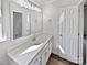 Clean bathroom featuring a large mirror, vanity with ample counter space, and modern fixtures at 1727 Running Brook Rd, Charlotte, NC 28214
