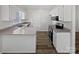Well-lit kitchen boasts granite countertops, modern stainless steel appliances, and ample cabinet space at 1727 Running Brook Rd, Charlotte, NC 28214