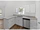 Bright kitchen with stainless steel appliances, granite counters, and custom cabinets at 1727 Running Brook Rd, Charlotte, NC 28214