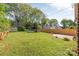 Expansive backyard with green grass, shed, and privacy fence at 2221 Commonwealth Ave, Charlotte, NC 28205