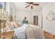 Bright bedroom featuring brass bed, hardwood floors, and neutral color palette at 2221 Commonwealth Ave, Charlotte, NC 28205