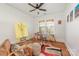Bright bedroom featuring hardwood floors, natural light, and unique artwork at 2221 Commonwealth Ave, Charlotte, NC 28205