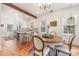 Dining room featuring hardwood floors, chandelier, and an open concept design at 2221 Commonwealth Ave, Charlotte, NC 28205