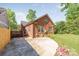Charming brick home with a well-manicured lawn and a paved driveway at 2221 Commonwealth Ave, Charlotte, NC 28205