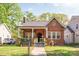 Charming brick home with a cozy front porch and well-maintained landscaping at 2221 Commonwealth Ave, Charlotte, NC 28205