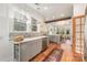 Spacious kitchen featuring marble countertops, stainless appliances, and hardwood floors at 2221 Commonwealth Ave, Charlotte, NC 28205