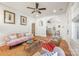 Cozy living room with hardwood floors, ceiling fan, colorful sofa and natural light at 2221 Commonwealth Ave, Charlotte, NC 28205