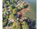 Aerial view of waterfront property with docks, showcasing the lakefront living at 235 Commodore Loop, Mooresville, NC 28117