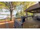 Inviting back deck with lake views and grill, ideal for outdoor gatherings and relaxation at 235 Commodore Loop, Mooresville, NC 28117