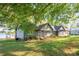 View of the backyard, landscaped lawn and lake with dock at 235 Commodore Loop, Mooresville, NC 28117