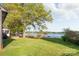 Sprawling backyard with lush lawn leading to the lake and dock, perfect for outdoor enjoyment at 235 Commodore Loop, Mooresville, NC 28117