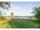 Expansive backyard lawn leading to a gazebo and dock on the lake at 235 Commodore Loop, Mooresville, NC 28117
