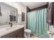 Contemporary bathroom features a modern vanity, sleek fixtures, and a stylish shower with dark tile at 235 Commodore Loop, Mooresville, NC 28117