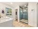 Bathroom featuring a double vanity sink and a glass door shower at 235 Commodore Loop, Mooresville, NC 28117