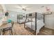 Spacious bedroom features unique bunk beds, a stylish rug, a desk, and plenty of natural light at 235 Commodore Loop, Mooresville, NC 28117