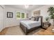 Comfortable bedroom with natural light streaming through a window, decorated with simple art at 235 Commodore Loop, Mooresville, NC 28117