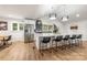 Spacious kitchen boasts a large island with seating, stainless appliances, and modern lighting at 235 Commodore Loop, Mooresville, NC 28117