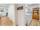 Convenient laundry area with modern machines, storage, and easy access from the hallway at 235 Commodore Loop, Mooresville, NC 28117