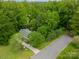 Lush aerial view of home surrounded by mature trees along a quiet street at 2646 Jacobs Rd, Gastonia, NC 28054