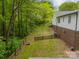 Expansive backyard with mature trees, fire pit, and fenced in area at 2646 Jacobs Rd, Gastonia, NC 28054