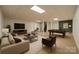 Spacious finished basement with a pool table, comfortable seating, and ample lighting at 2646 Jacobs Rd, Gastonia, NC 28054