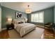 Comfortable bedroom with neutral tones, a king-size bed, and natural light at 2646 Jacobs Rd, Gastonia, NC 28054