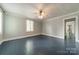 Bright bedroom featuring painted wood floors and a large window at 2646 Jacobs Rd, Gastonia, NC 28054