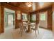 Cozy dining area with wood-paneled walls and a round table at 2646 Jacobs Rd, Gastonia, NC 28054