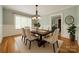 Dining room featuring wood table, six chairs, chandelier, and natural light at 2646 Jacobs Rd, Gastonia, NC 28054