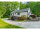 Charming exterior of a white home with a well-maintained yard and curved driveway at 2646 Jacobs Rd, Gastonia, NC 28054