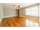 Bright and airy living room with gleaming hardwood floors, neutral paint, and a ceiling fan at 2646 Jacobs Rd, Gastonia, NC 28054