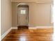Spacious living room features gleaming hardwood floors, neutral walls, arched doorway and natural light at 2646 Jacobs Rd, Gastonia, NC 28054