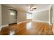 Inviting living room features gleaming hardwood floors, neutral paint, and large windows at 2646 Jacobs Rd, Gastonia, NC 28054
