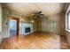 Spacious living room features wood floors, fireplace, and decorative lighting at 2646 Jacobs Rd, Gastonia, NC 28054