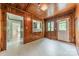 Cozy room boasts wood-paneled walls, a pass-through bar to the kitchen, and exterior access at 2646 Jacobs Rd, Gastonia, NC 28054